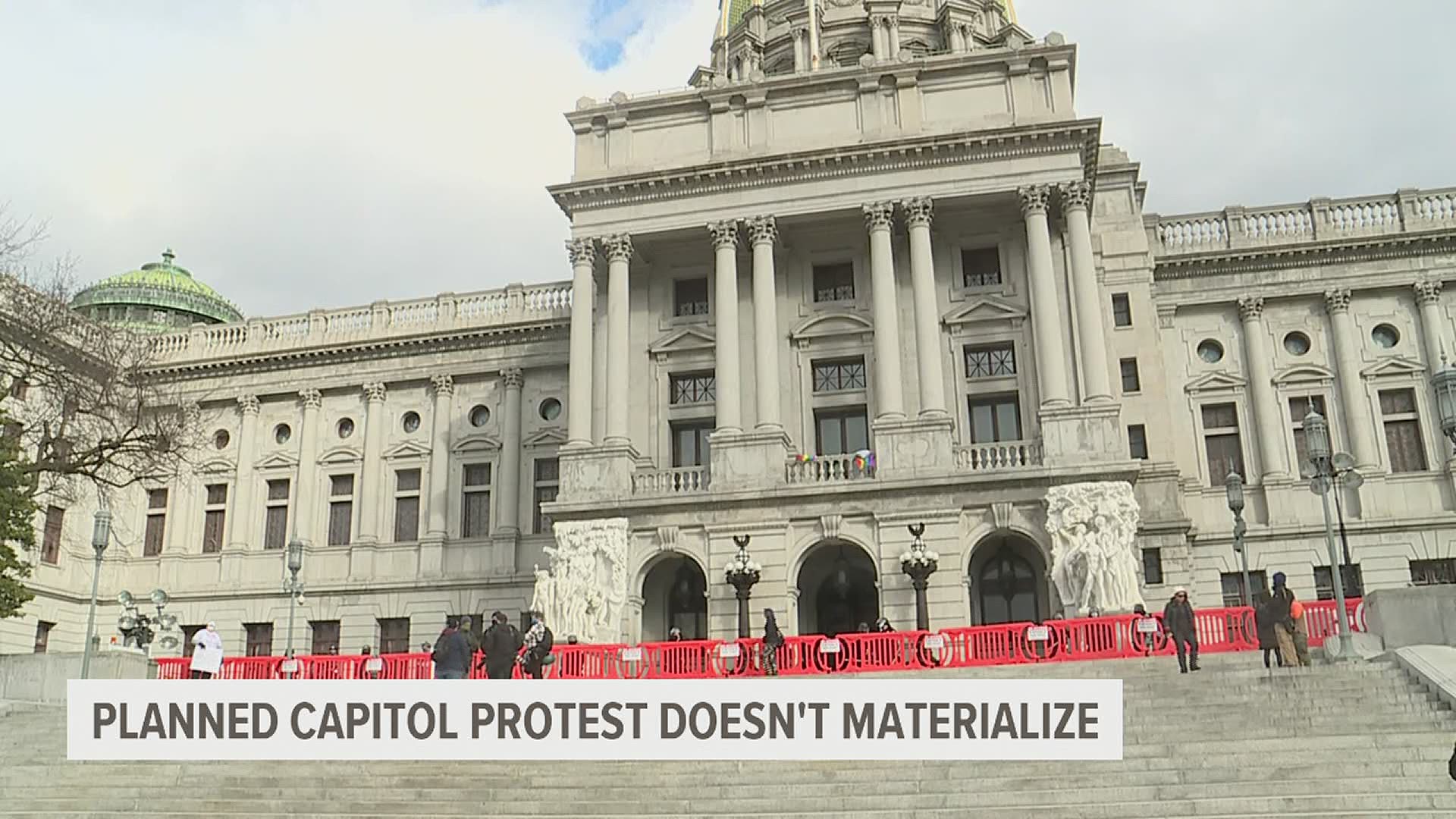In Harrisburg, security personnel and journalists covering the expected protests far outnumbered the few protesters who showed up outside the Capitol building.