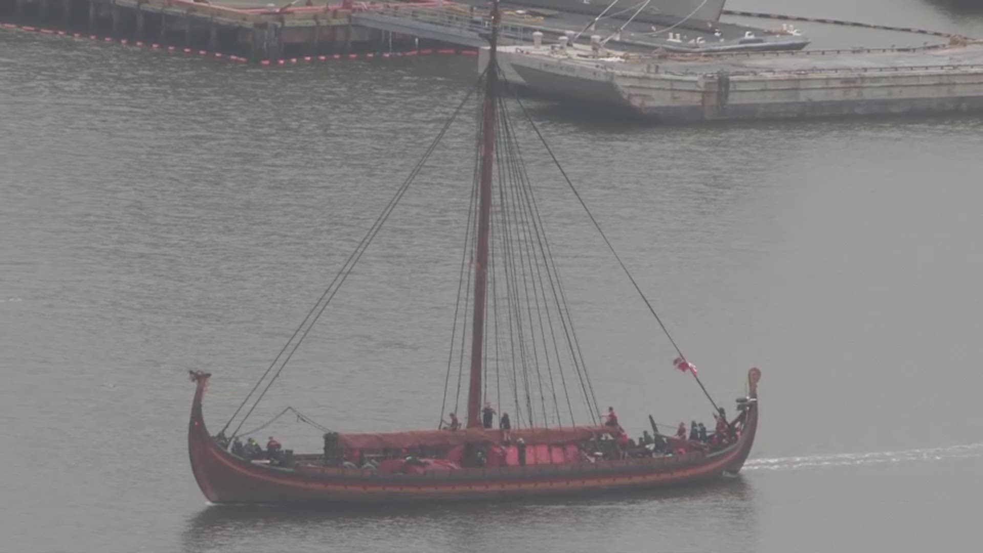 As the Viking ship Draken Harald Hårfagre made its way to its stop at Nauticus in Norfolk, Virginia, a pod of dolphins came up from the water to greet it.