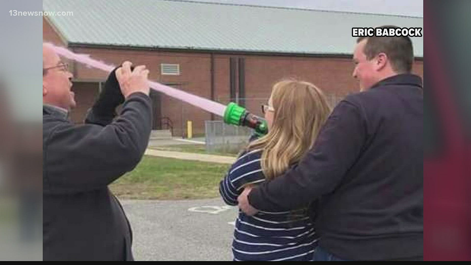 Family and friends were there for the big announcement, which was made as the couple shot dyed water out of a fire hose.