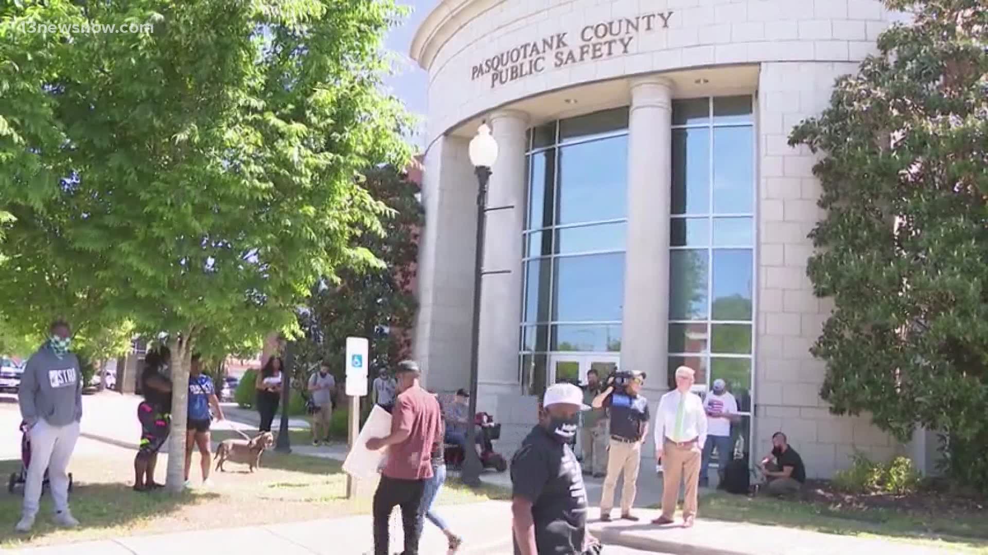 As the DA held a press conference inside public safety building, outside, demonstrators gathered in protest.