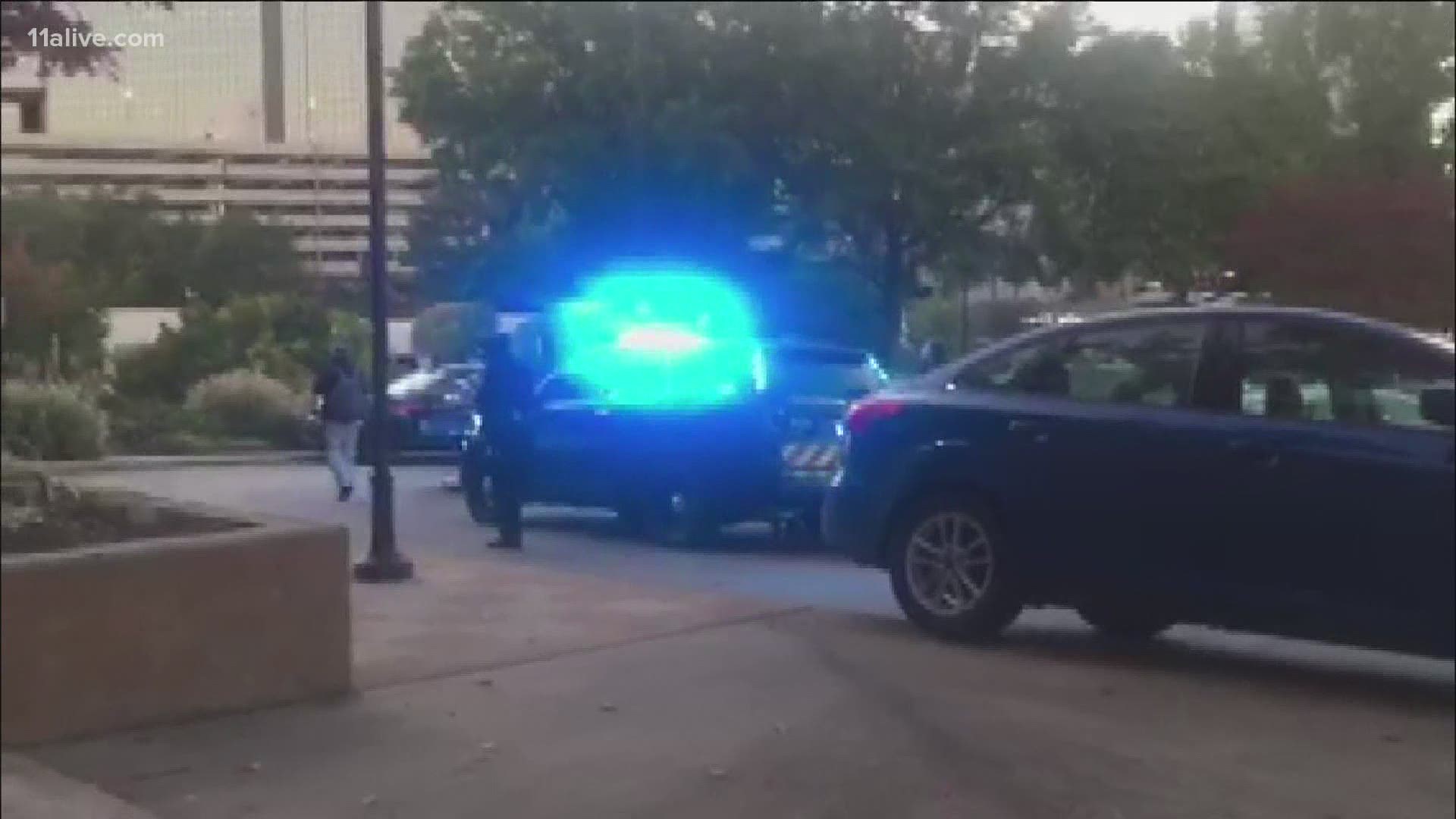Police say the gunfire occurred inside the Neiman Marcus store after four men allegedly tried to rob another at a cash register.
