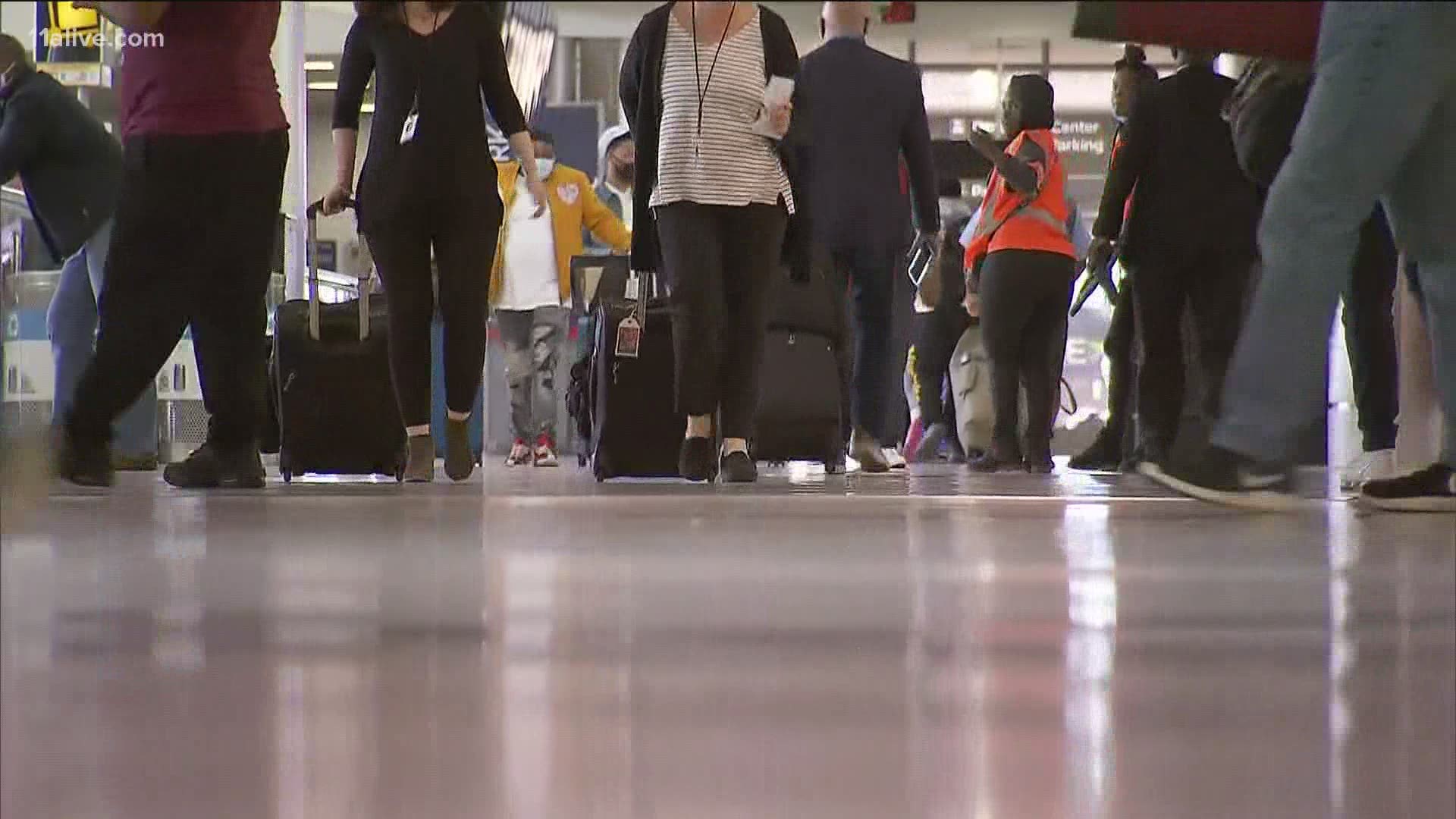 Here's what health experts are recommending for those traveling during the holidays.