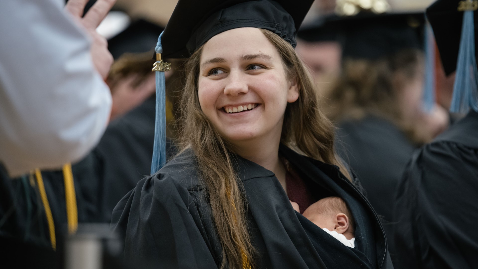 "I’d worked hard for this degree, and I was determined to walk with the rest of my class… so I just brought her to graduation with me,” said Grace Szymchack.