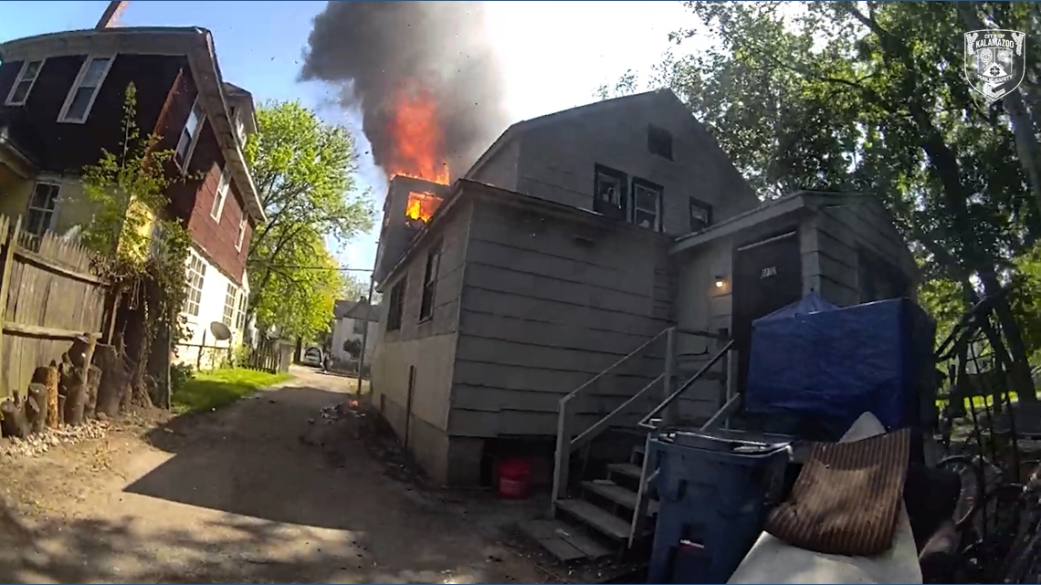 BODYCAM VIDEO: Officer catches baby dropped from window of burning home in Michigan
